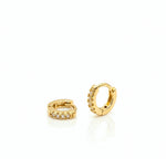 Two gold hoop earrings with embedded stones on a white background